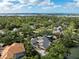 Beautiful aerial shot of a sprawling estate nestled among lush greenery and waterfront at 49 Osprey Point Dr, Osprey, FL 34229