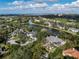 Aerial view showcasing the neighborhood with stunning lake and ocean views at 49 Osprey Point Dr, Osprey, FL 34229