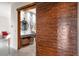 Modern bathroom with a wooden sliding barn door, dual sinks, and view into a bedroom at 49 Osprey Point Dr, Osprey, FL 34229