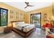 Bright bedroom with a modern ceiling fan and pool access at 49 Osprey Point Dr, Osprey, FL 34229