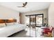 Spacious bedroom with sliding door access to a relaxing pool area, seamlessly blending indoor and outdoor living at 49 Osprey Point Dr, Osprey, FL 34229
