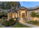 Beautiful home featuring a stone walkway leading to a striking entryway and modern design at 49 Osprey Point Dr, Osprey, FL 34229