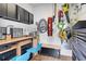 Organized garage featuring workbenches, storage cabinets, and various tools at 49 Osprey Point Dr, Osprey, FL 34229