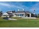 Expansive view of the golf course highlighting the manicured lawns, sand traps, and exquisite architectural design at 49 Osprey Point Dr, Osprey, FL 34229