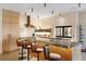Bright kitchen boasting modern cabinets, a breakfast bar with comfortable seating, and sleek countertops at 49 Osprey Point Dr, Osprey, FL 34229