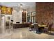 Stylish living space with custom shelving, modern lighting, and a comfortable leather sofa at 49 Osprey Point Dr, Osprey, FL 34229