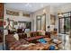 Spacious living area with designer furniture, featuring an oversized leather sofa and stylish decor at 49 Osprey Point Dr, Osprey, FL 34229