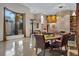 Open-concept living area with elegant decor, including a statement art piece and a grand window view at 49 Osprey Point Dr, Osprey, FL 34229