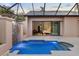 Inviting pool and waterfall feature with bedroom view; a perfect private retreat for relaxation and enjoyment at 49 Osprey Point Dr, Osprey, FL 34229