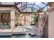 Beautiful backyard pool area with waterfall feature and open air shower at 49 Osprey Point Dr, Osprey, FL 34229