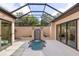 Enclosed patio with a lovely pool and water feature, perfect for relaxing or entertaining at 49 Osprey Point Dr, Osprey, FL 34229