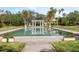 Formal water feature with symmetrical design and a gazebo in the background, surrounded by palm trees at 49 Osprey Point Dr, Osprey, FL 34229