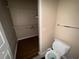 Bathroom featuring a toilet and walk-in closet with wire shelving for storage at 5560 Rosehill Rd # 105, Sarasota, FL 34233