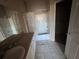 Tiled bathroom featuring a shower and tub combo, decorative shower curtain, vanity and tile flooring at 5560 Rosehill Rd # 105, Sarasota, FL 34233