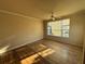 Bedroom with a large window and laminate flooring at 5560 Rosehill Rd # 105, Sarasota, FL 34233