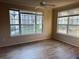 Bright bedroom with large windows and wood floors at 5560 Rosehill Rd # 105, Sarasota, FL 34233