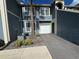 Two-story townhouse featuring a one car garage and landscaped yard at 5560 Rosehill Rd # 105, Sarasota, FL 34233