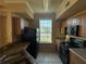 The kitchen features a stove, microwave and ample counter space at 5560 Rosehill Rd # 105, Sarasota, FL 34233