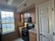 Functional kitchen space featuring modern appliances and a window overlooking the outside at 5560 Rosehill Rd # 105, Sarasota, FL 34233
