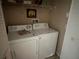 A functional laundry area with a washer and dryer set for convenient chores at 5560 Rosehill Rd # 105, Sarasota, FL 34233