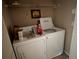 Laundry area with a side-by-side washer and dryer for easy laundry duties at 5560 Rosehill Rd # 105, Sarasota, FL 34233