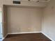 Spacious living room features neutral paint and dark floors at 5560 Rosehill Rd # 105, Sarasota, FL 34233