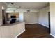 Bright and airy living room features hardwood floors, neutral walls, and an open layout at 5560 Rosehill Rd # 105, Sarasota, FL 34233