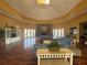 Spacious lounge with a cozy fireplace and comfortable seating on hardwood floors at 5560 Rosehill Rd # 105, Sarasota, FL 34233