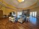 Spacious lounge with a cozy fireplace and comfortable seating on hardwood floors at 5560 Rosehill Rd # 105, Sarasota, FL 34233