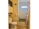 Cozy bathroom includes built-in storage shelves and a standard shower-tub combination at 5791 Holiday Park Blvd, North Port, FL 34287