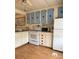 Functional kitchen with white appliances and ample cabinet space, offering a practical cooking area at 5791 Holiday Park Blvd, North Port, FL 34287