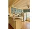 Functional kitchen with white appliances and ample cabinet space, offering a practical cooking area at 5791 Holiday Park Blvd, North Port, FL 34287