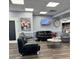 Inviting lobby area, showcasing sleek black leather couches, a round table, and elegant artwork at 5791 Holiday Park Blvd, North Port, FL 34287