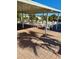Open-air patio with shade from roof, complete with seating arrangements for residents to relax at 5791 Holiday Park Blvd, North Port, FL 34287