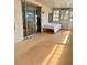 Bright sunroom with sliding glass doors, a large window, and outdoor access at 5791 Holiday Park Blvd, North Port, FL 34287