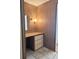 Small vanity alcove featuring mirror, lamp, drawers and counter space at 5791 Holiday Park Blvd, North Port, FL 34287