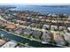 Picturesque aerial view of waterfront homes with private pools and boat docks, showcasing the idyllic coastal living at 581 Mast Dr, Bradenton, FL 34208