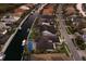 A beautiful aerial view of a waterfront neighborhood featuring lovely houses and navigable canals at 581 Mast Dr, Bradenton, FL 34208