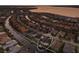 Sunset aerial view of canal-front neighborhood featuring luxurious homes with waterfront access, private docks, and stunning views at 581 Mast Dr, Bradenton, FL 34208
