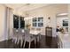 Dining room with contemporary table and chairs, and wine storage, creating an inviting space for meals at 581 Mast Dr, Bradenton, FL 34208
