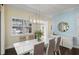 Dining room with neutral wall color and a window with shutter panels at 581 Mast Dr, Bradenton, FL 34208