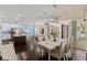 Open concept dining room and kitchen combination with access to an outdoor living space at 581 Mast Dr, Bradenton, FL 34208