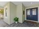 Charming front porch with decorative front door, a window, and well maintained brick flooring and exterior siding at 581 Mast Dr, Bradenton, FL 34208