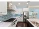 A kitchen featuring a gas range, stainless steel appliances, and a blue backsplash at 581 Mast Dr, Bradenton, FL 34208