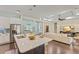 Open-concept kitchen with a large island, stainless steel appliances, and seamless flow into the living area at 581 Mast Dr, Bradenton, FL 34208