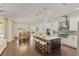 Expansive kitchen with granite island, stainless appliances, and open view to the living and dining areas at 581 Mast Dr, Bradenton, FL 34208