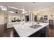 The kitchen island features a sink, countertop seating, and is centrally located to the living and dining rooms at 581 Mast Dr, Bradenton, FL 34208