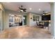 The open patio features an outdoor kitchen and seating area, with a view to the home's interior at 581 Mast Dr, Bradenton, FL 34208
