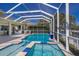 Gorgeous pool and spa with a screened-in enclosure, offering the perfect space to unwind and enjoy the Florida sunshine at 581 Mast Dr, Bradenton, FL 34208