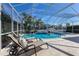 Inviting pool area with comfortable lounge chairs, perfect for relaxing in the sun at 581 Mast Dr, Bradenton, FL 34208